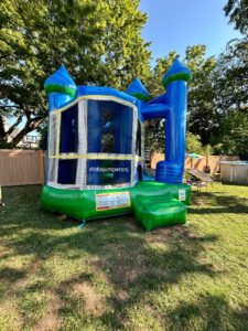 Blue bouncy house combo with a slide